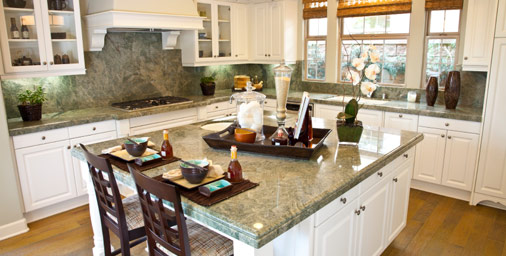 Kitchen with finished wood floor and island