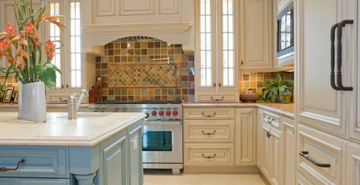 Eclectic Kitchen with lightly finished wood cabinets