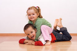 Children enjoying Radiant Floor Heating